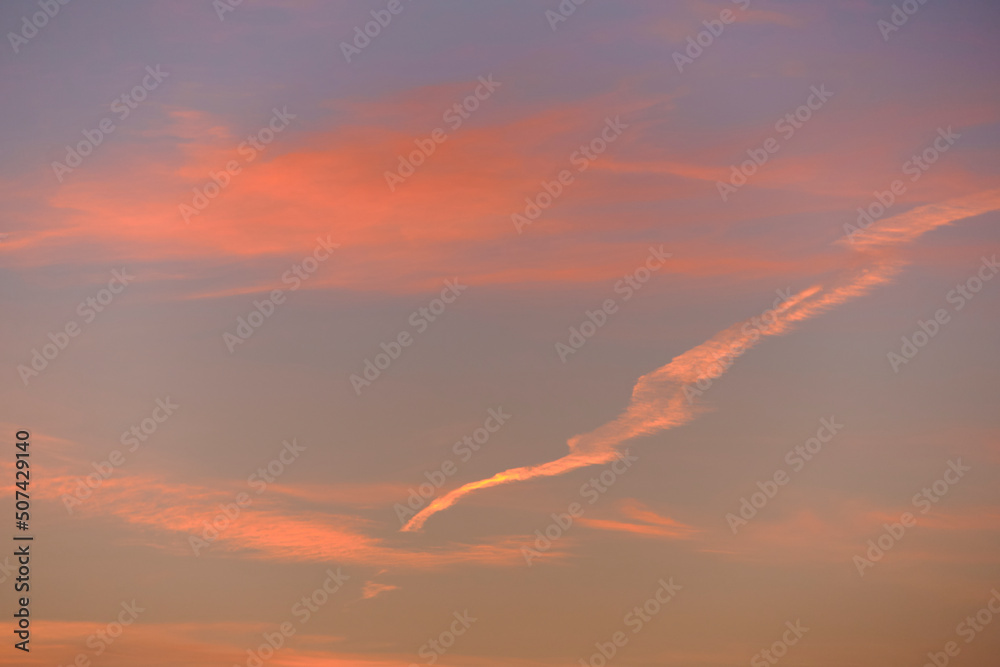 Sky light after sunset. orange background, clouds