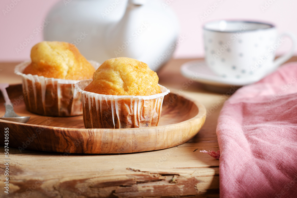 Delicious muffin on a rustic wooden background. Delicious muffin on a rustic wooden background.