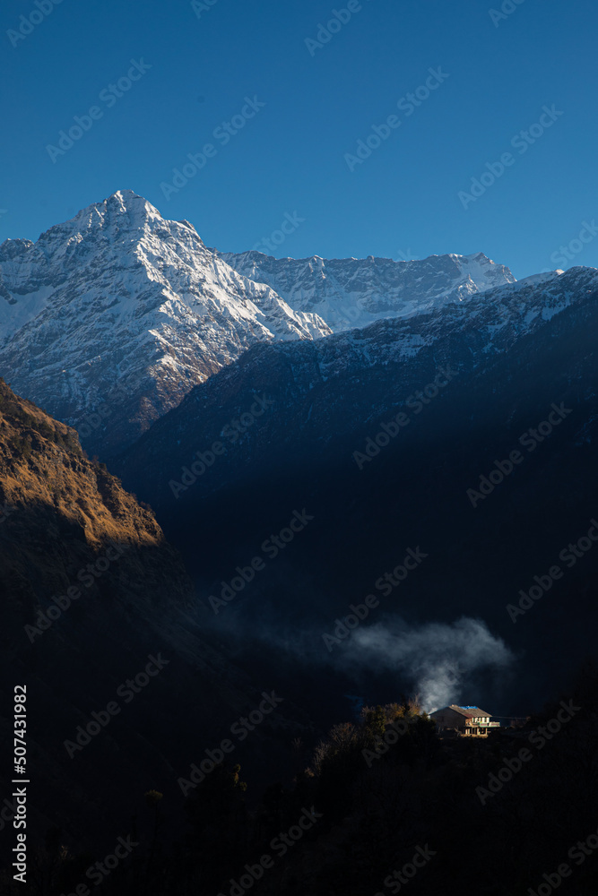 Picturesque village of Himalayas. Beautiful village amidst of snow covered peaks  