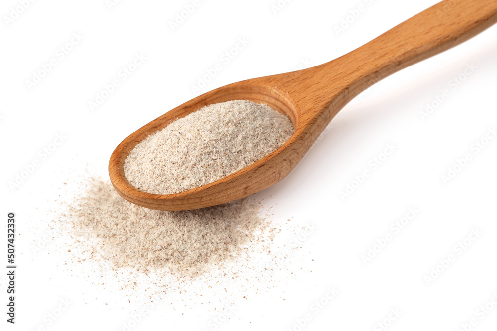 Raw rye flour in the wooden spoon, isolated on white background. Raw rye flour in the wooden spoon, isolated on white background.