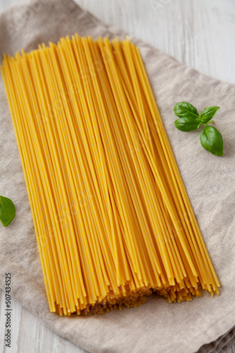 Raw Organic Spaghetti Pasta in a Bunch, low angle view.