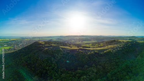 Panorama of a view from a height of the meadows and slopes of the Balkan Mountains under daylight in Bulgaria