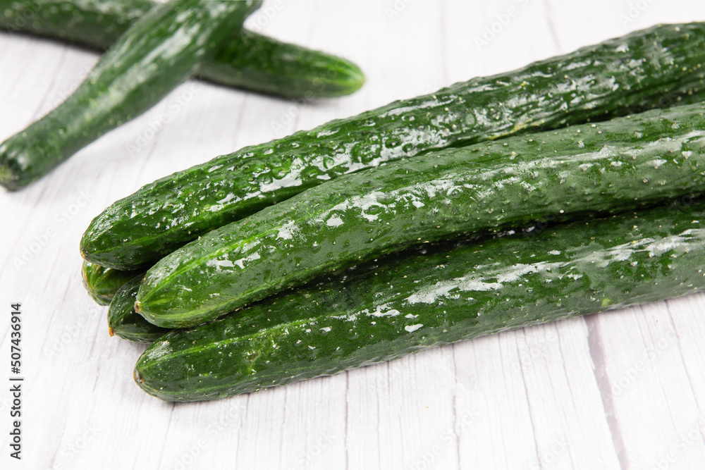 fresh cucumbers on wooden table