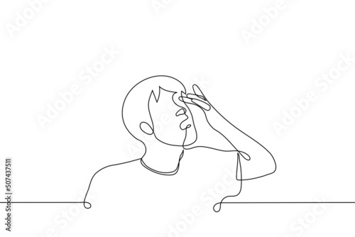 man rubs his eye with a finger or inserts a lens - one line drawing vector. the concept of vision problems, conjunctivitis, correct the lens