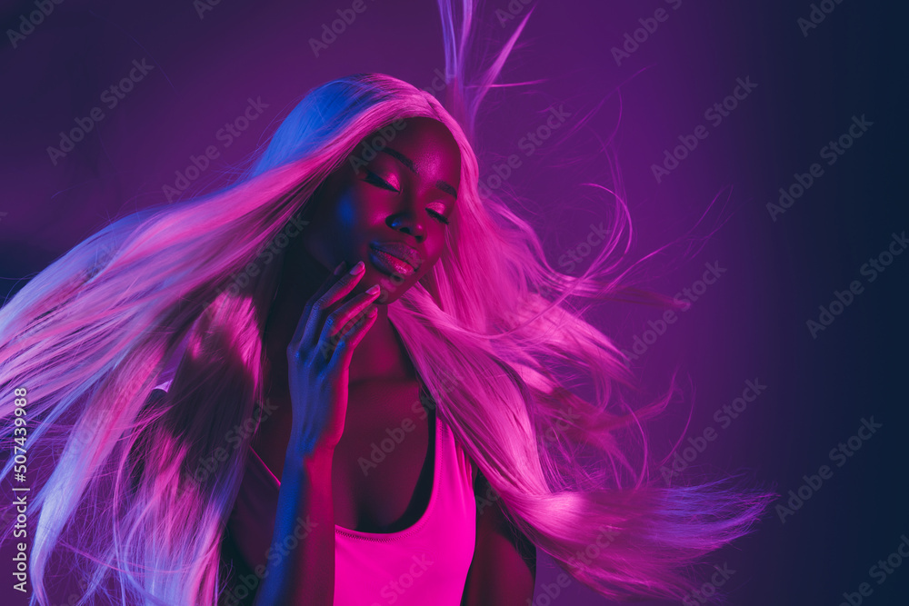 Picture of alluring tempting female seducing man in nightclub touch face isolated on violet fluorescent background