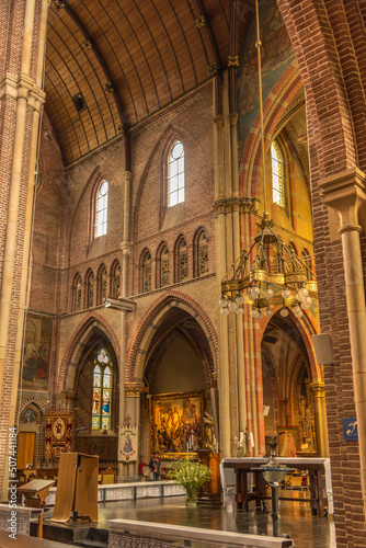 Alkmaar, Netherlands, May 2022. The interior of a church with religious artifacts.