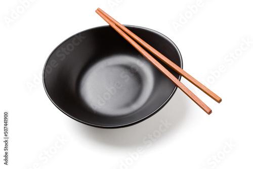 wooden chopsticks on a black bowl