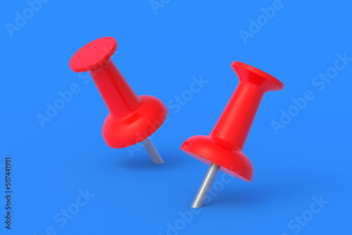 Push pins on blue background. Stationery tools. Office equipment. School education. 3d render