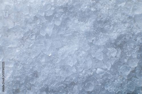 Coarse white iodized salt. Detailed background texture Macro close-up. Salt crystals of different sizes