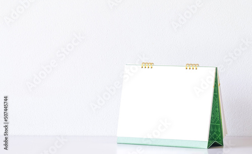 Stock cover Wall calendar mock up on a white wall background. High resolution.