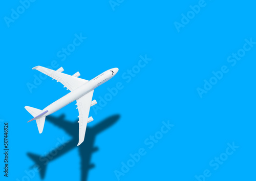 Airplane model for online ticket and tourism concept, airplane blue background.