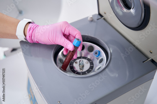 Tubes filled with blood are in plasma-lifting centrifuge in laboratory