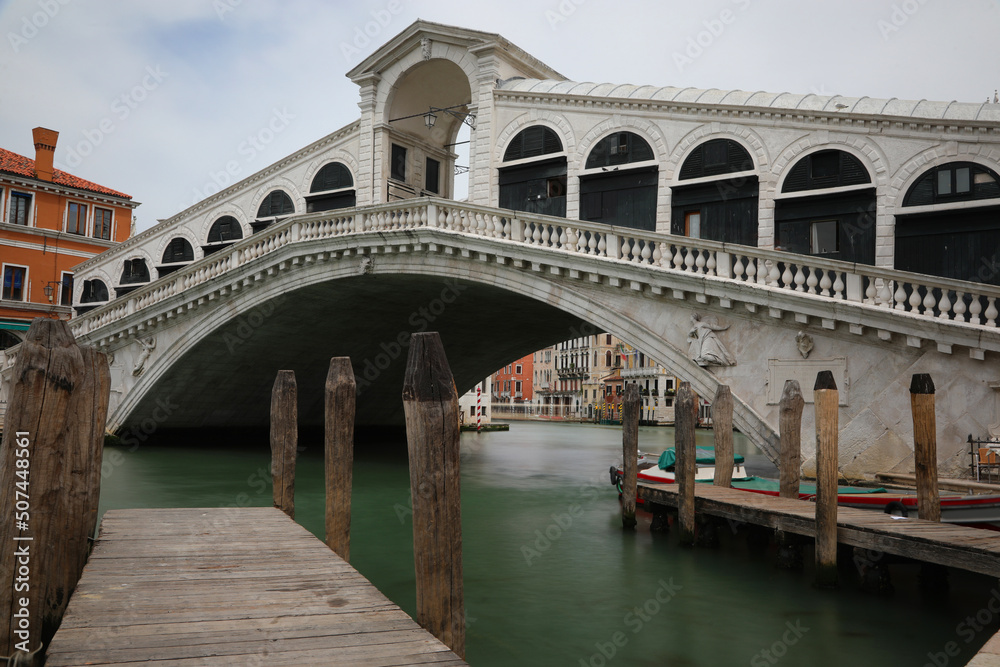 Rialto bridge in Venice in Italy usually very busy but now without people during the terrible lockdown caused by the corona virus with long exposure time
