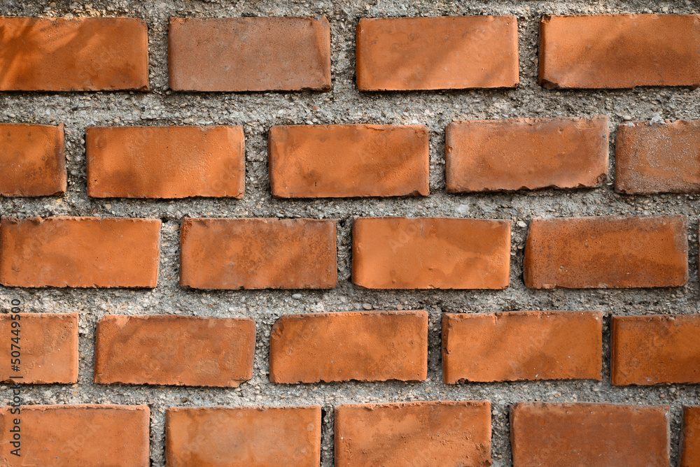 Obraz premium Texture of red brick wall as background, closeup view