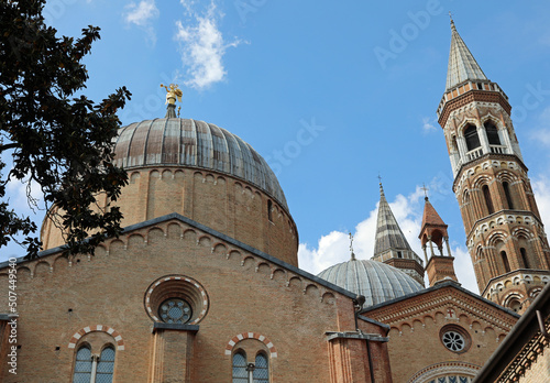 Bell towers and dome of the Basilica of Saint Anthony from Padua also called SANTO ANTONIO in Italian language in Padova City in Italy and the golden angel used as a weather vane photo