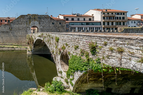 The ancient Mercatale bridge over the Bisenzio river, which gives access to the historic center of Prato, Italy photo