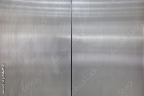 stainless steel door background and texture. elevator metal door. photo