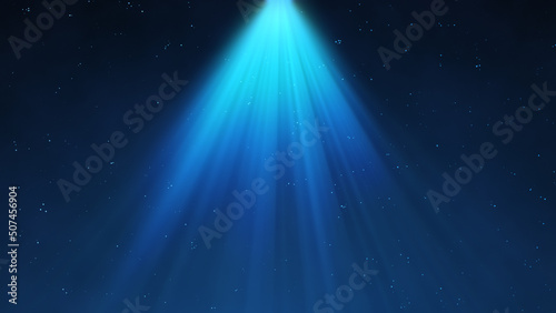 Spotlight background. Festive abstract spot light. Bright rays.  Glowing particles. Blue color. photo