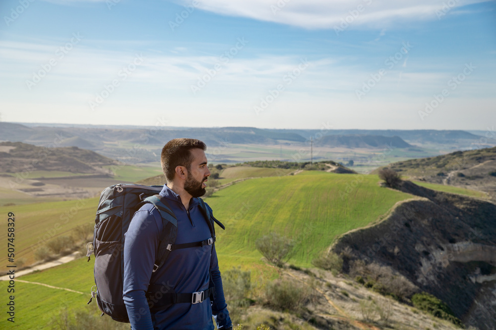 Fototapeta premium Bearded young man looking into infinity with plenty of copy space