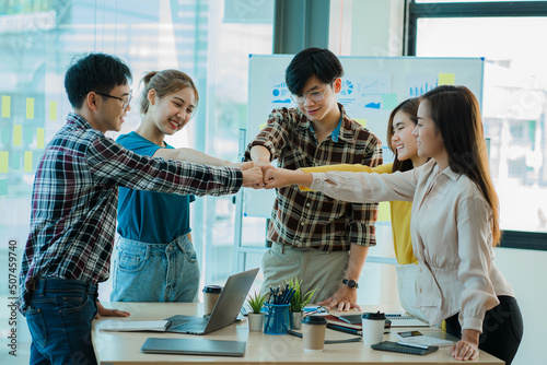 Collaboration of Asian Businessmen Group in the Office of Successful Business Teamwork Hands-on Collaboration young people Handshake during the meeting for teamwork and collaboration ideas.