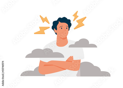 A sad young man has a clouded mind on blue background. A depressed teenager boy suffers from temporary memory.