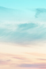 Vertical ratio size of sunset background. sky with soft and blur pastel colored clouds. gradient cloud on the beach resort. nature. sunrise.  peaceful morning. Instagram toned style