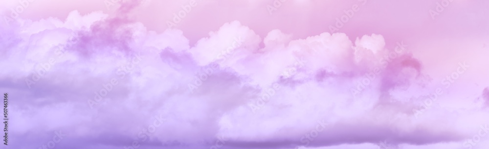 Panorama of twilight sky with effect of light pastel pink colors. Colorful sunset of soft clouds.