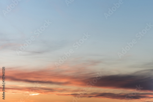 Twilight sky with effect of light pastel colors. Colorful sunset of soft clouds.