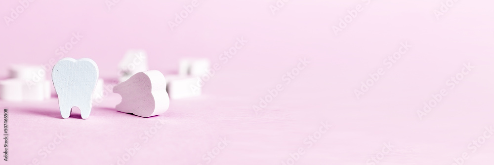 Banner with white beautiful teeth on pink background. Oral hygiene, stomatology, caries and periodontal disease prevention concept. Copy space. High quality photo