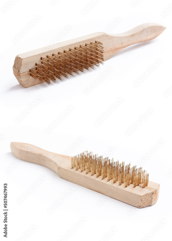 Brass brush with wooden handle isolated on white background