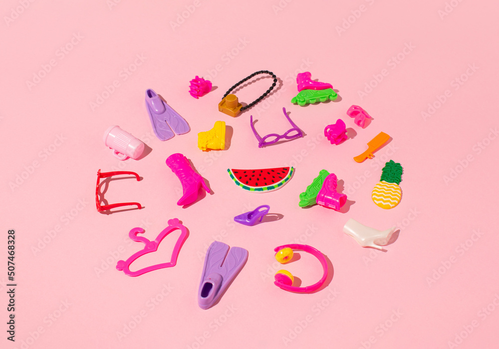 The creative layout is made of women's accessories on pink background. Minimal summer travel concept. Pop art.