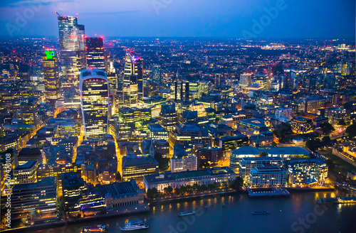 City of London at sunset. View include modern skyscrapers  banks and office buildings and river Thames