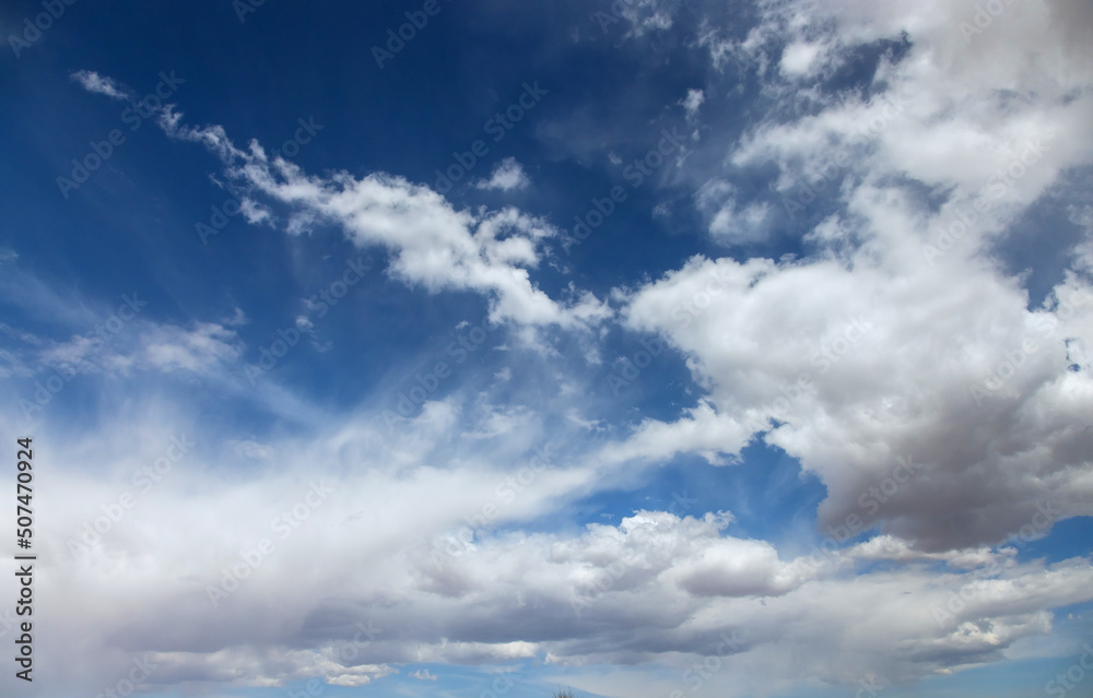Beautiful landscape with blue sky the moving fluffy cumulus clouds