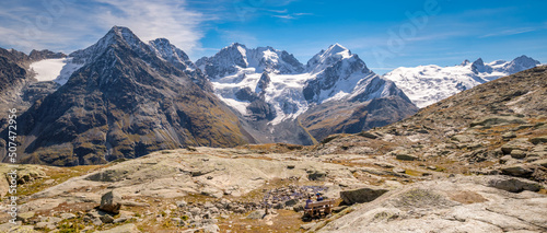 Fuorcla Surlej is a mountain pass in the Swiss Alp (connecting the Upper Engadine Valley with Roseg Valley) with stunning views on the Bernina Massif. There is also a small lake and a mountain hut. photo
