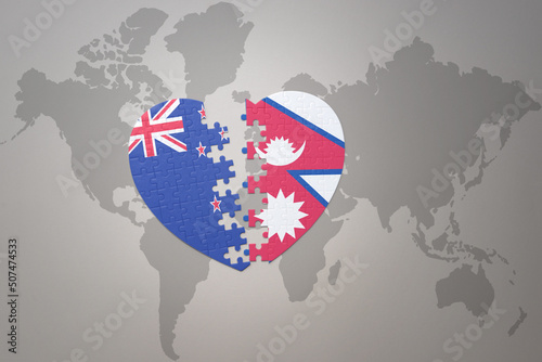 puzzle heart with the national flag of new zealand and nepal on a world map background. Concept.