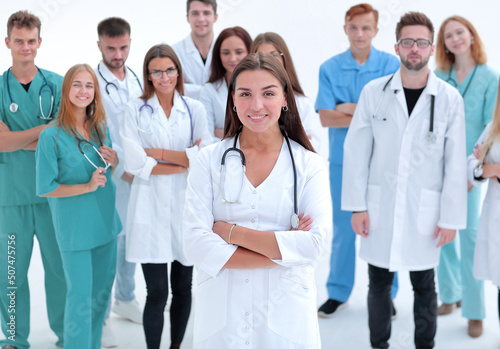 large group of medical professionals applauding their leader