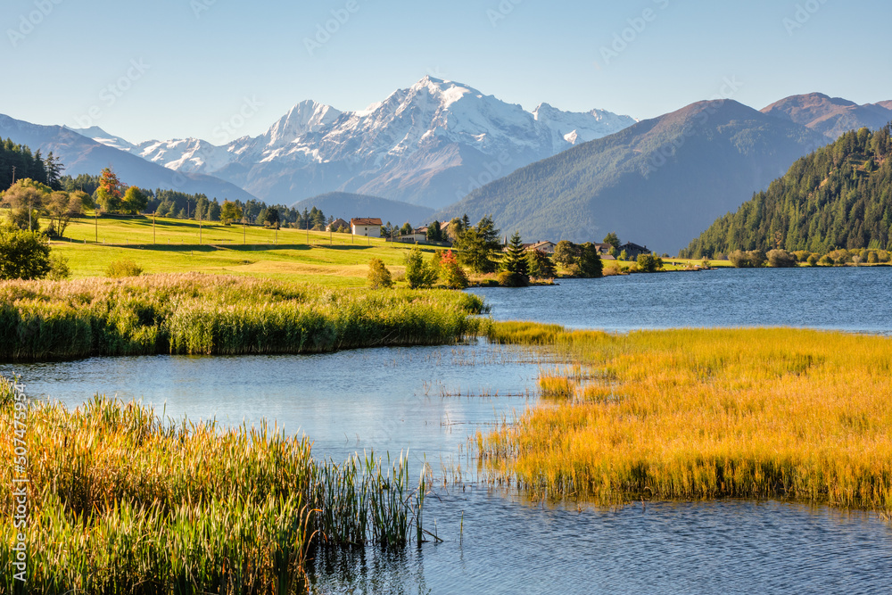 Past the Austria-Italy border and Reschen Pass, lies St. Valentin auf der Haide with its gorgeous Lake Haider and view on the Ortler Mountain Group. It lies in South Tyrol in Vinschgau or Val Venosta