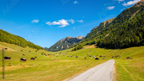Pfundser Tschey is one of the most beautiful high valleys of Tyrol (Austria). The panorama with hay barns and the Maria Schnee chapel is gorgeous. Tschey means high valley in Rhaeo-Romanic. © Chris