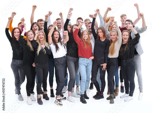 group of confident young people standing with their hands up