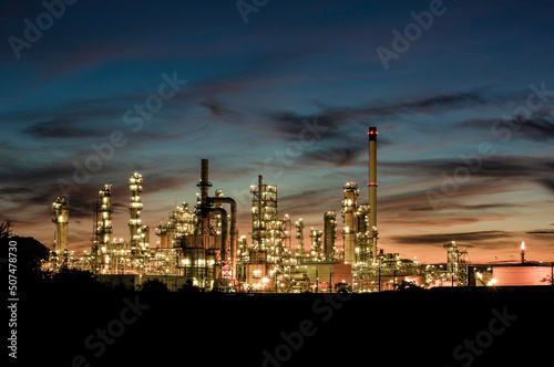 Twilight scene of tank oil refinery plant and tower column of Petrochemistry © chitsanupong