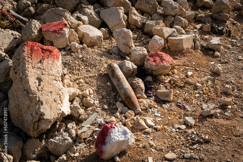 Darayya, Syria - April, 2022: Unexploded bomb or projectile in ruins in destroyed city after the Syrian Civil War. photo