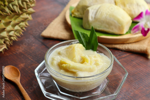 Thai sweet sticky rice with durian in coconut milk at close up view - Thai dessert called Khao Nieow Nam Kati Durian 