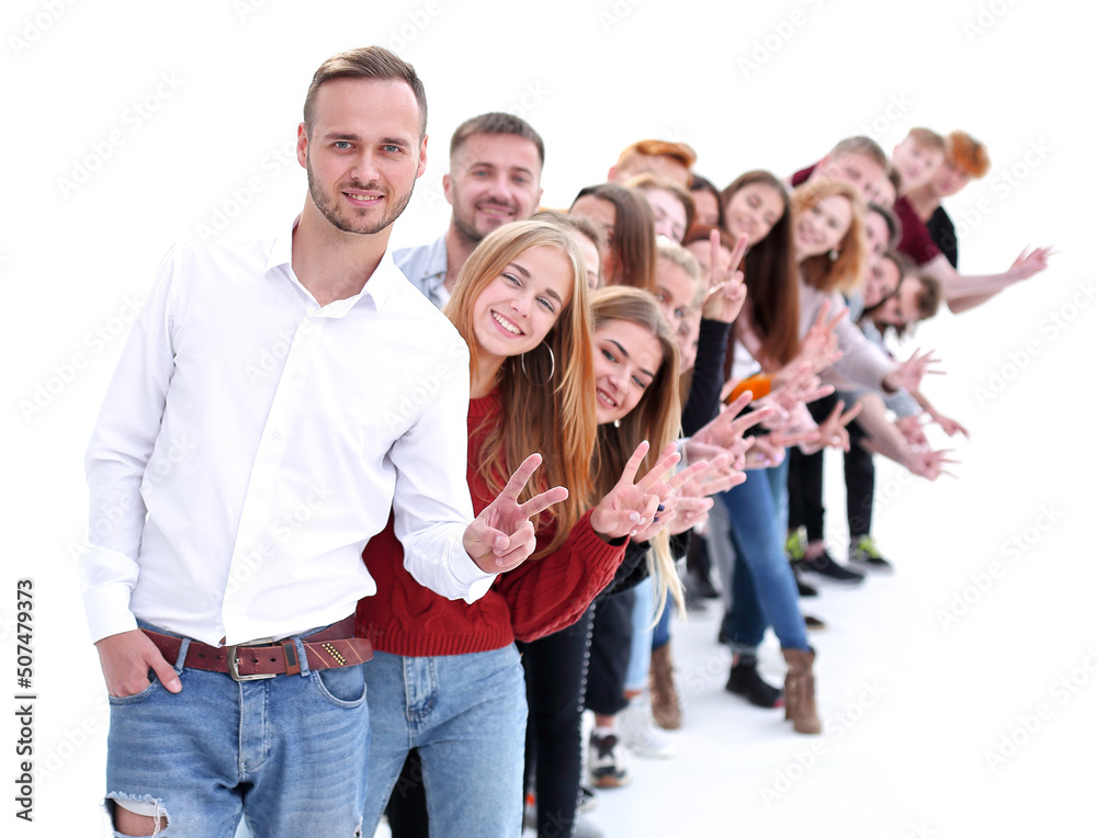 confident guy standing first in the column of young people