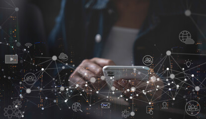 IoT Internet of Things, digital technology, global network connection, social media marketing concept. Wman using mobile smart phone and smart city with technology icons