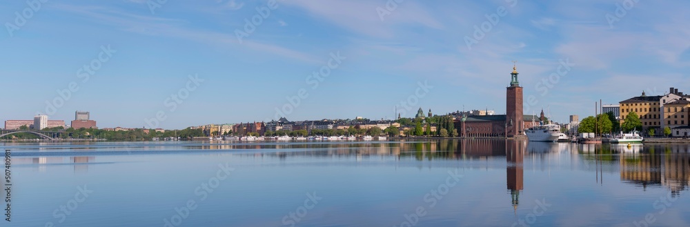 Panorama view over the island Riddarholmen with court houses and the Town City Hall a sunny summer day in Stockholm