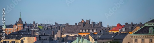 Photography Panorama view over tin roofs, dorms and towers of the old town Gamla Stan a sunn