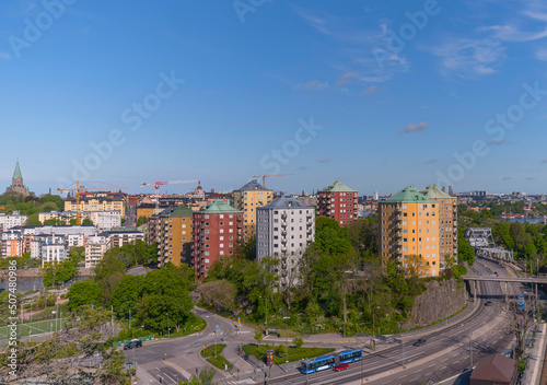Hill view over the district Södermalm a apartment houses a counter weight bridge and ships a sunny summer day in Stockholm