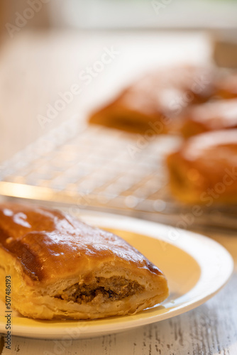 Sausage rolls or saucijzenbroodje a traditional Dutch savoury puff pastry with meat as a snack photo