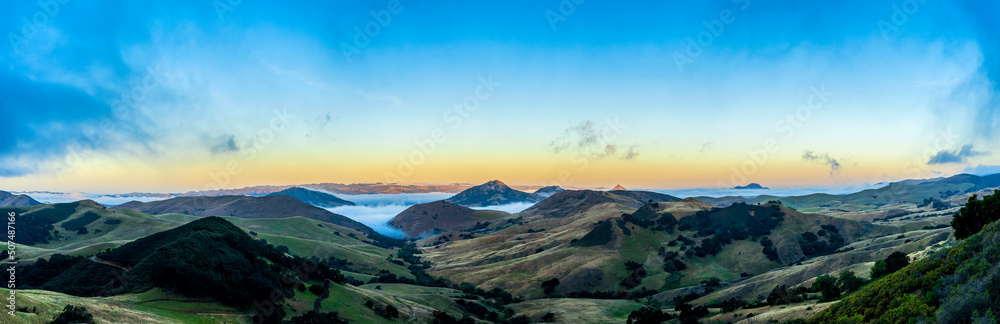 Panorama of Mountains, valley, fog, clouds