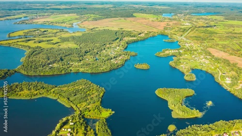 Hyperlapse Timelapse Dronelapse 4K Aerial View Of Villages Houses On Rivers Lakes Islands Summer Day. Top View Of Lake Nature From Attitude. Scenery Scenic Calm Landscape. photo